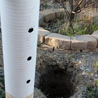 Cut a roughly 25 inch (2 foot plus 1 inch) length of the perforated pipe. The goal is to have the pipe stick out of the ground a little bit, so it may depend on how deep a hole you dig.
